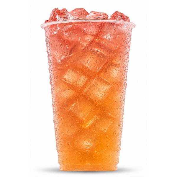A cold, refreshing orange and red iced drink in a clear plastic cup with condensation.